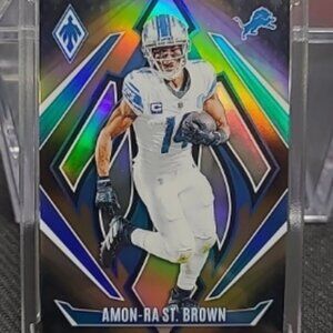 2024 Panini Phoenix Amon-Ra St. Brown Gold Fade /125 Lions